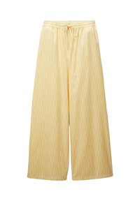 Pantalons larges à rayures jaunes et blanches avec une taille élastique et un cordon de serrage. Tissu lisse avec un design fluide.