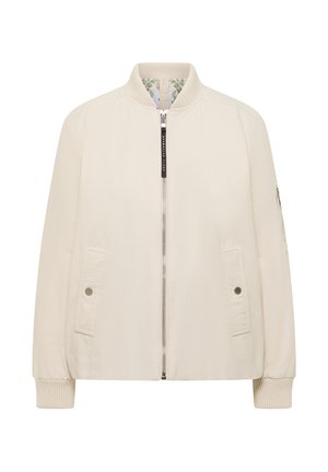 Veste bomber crème avec col et poignets côtelés, fermeture éclair avant, deux poches à boutons-pression, et poche zippée sur la manche gauche, doublure intérieure florale.