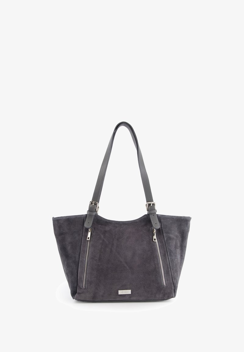 Gray suede tote bag with two zippered front pockets, dual gray straps, and a metallic logo accent on the front. Smooth texture.