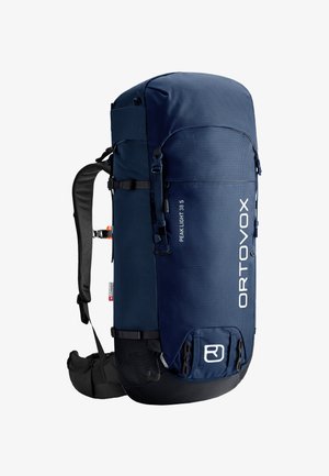 Dunkelblauer Rucksack mit runder Oberseite, aus strukturiertem Material gefertigt. Verfügt über verstellbare Riemen, seitliche Schnallen und gemusterte Akzente.