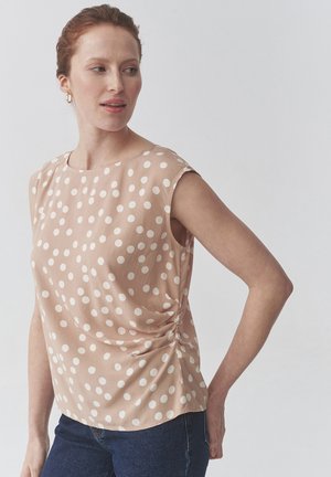 KOBIE - Print T-shirt - beige