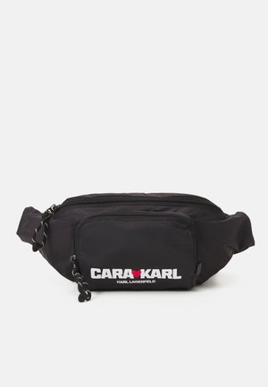 X CARA DELEVINGNE - Rumpetaske - black
