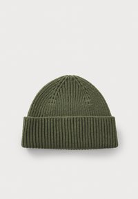 Knit beanie in dark green, featuring ribbed texture, a folded cuff, and a smooth top with subtle seam detailing.