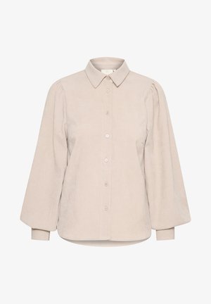 Bež srajca iz kordoroyja s ovratnikom, sprednjim gumbom in napihnjenimi dolgimi rokavi. Ima gladko teksturo in zaobljen rob.