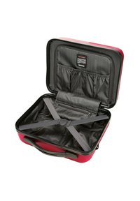 Valise à roulettes rouge avec une coque rigide, intérieur noir, sangles croisées et compartiment zippé ; elle présente une finition lisse et texturée.