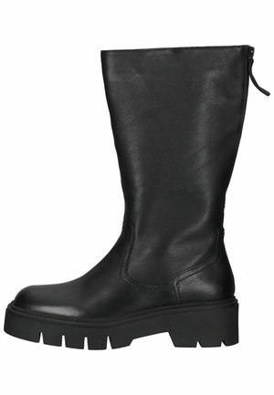 Botte mi-mollet en cuir noir avec semelle en caoutchouc épaisse et fermeture éclair au dos, conçue pour un usage décontracté ou robuste.