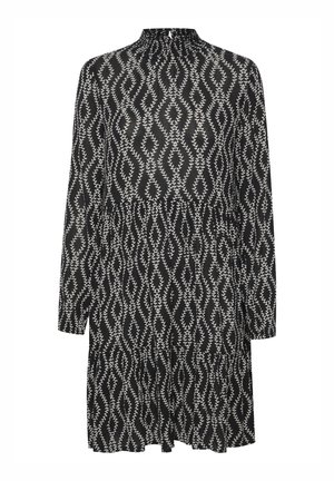 Zwart-witte jurk met lange mouwen, een hoge halslijn, een gelaagd ontwerp en een bladpatroon over de hele stof.