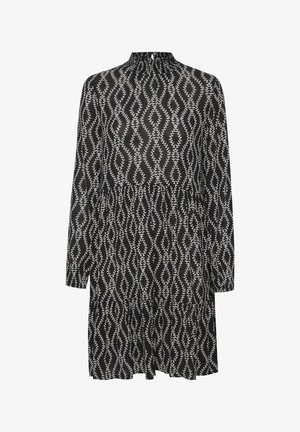 Zwart-witte jurk met lange mouwen, een hoge halslijn, een gelaagd ontwerp en een bladpatroon over de hele stof.