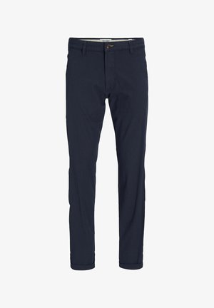 Tummansiniset housut, jotka on valmistettu puuvillasta. Slim fit -muotoilu, jossa on käännetyt lahkeet ja etupainike. Silkkinen koostumus ja minimaalinen muotoilu.