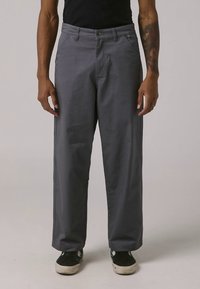 Gray, wide-leg pants made of smooth fabric, featuring a front button closure, standard pockets, and a relaxed silhouette.
