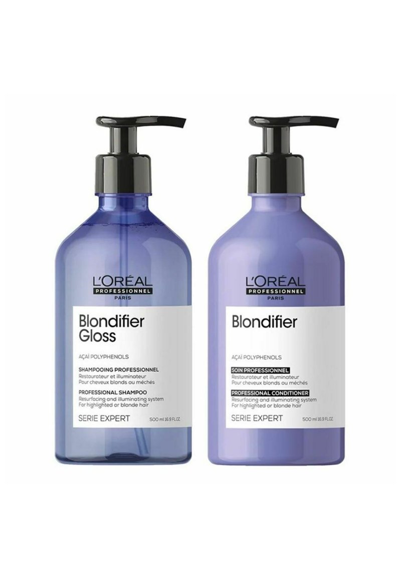 Two 500 ml bottles of L'Oréal Professionnel Blondifier hair products. One is a purple shampoo with a pump; the other a matching conditioner.