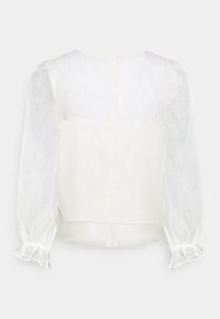 White blouse featuring sheer puff sleeves, a button-down back, and a soft textured fabric. Simple, minimalist design with a light, airy look.