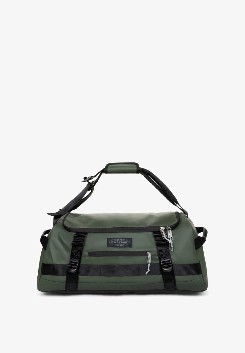 Bolsa de lona verde con acabado brillante e impermeable, detalles en negro, asa superior para llevar y correa ajustable para el hombro. Cuenta con un bolsillo frontal con cremallera.