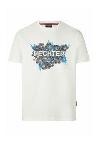 Witte katoenen t-shirt met een bloemig ontwerp in zwart en blauw, met de tekst "HECHTER PARIS" centraal weergegeven. Korte mouwen en ronde hals.