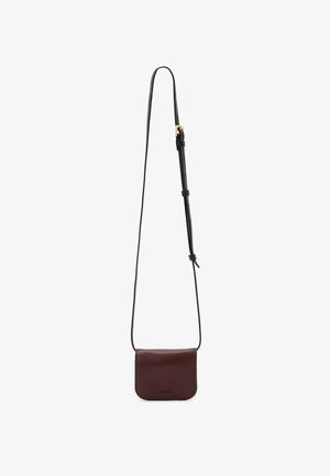 Burgundy leather crossbody bag with a detachable black strap, smooth texture, rectangular shape, and subtle embossed logo on the front.
