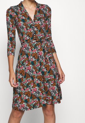Floral wrap dress with 3/4 sleeves, button front, and autumn-toned leaves and pink flowers on dark background.