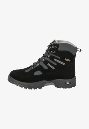 Black hiking boot with gray textile accents, reinforced toe, metal eyelets, and textured rubber sole for traction. Durable, waterproof design.