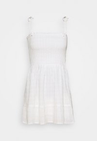 Bílé šaty bez rukávů se smocked korzetem a splývavou sukní. Vyrobené z lehkého materiálu, s nastavitelnými ramínky a vrstvovaným lemem.