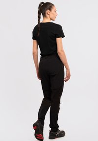 Rukka HIGHWAIST WARM - Friluftsbyxor - schwarz