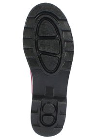 Black rubber shoe sole with a textured tread pattern, featuring a central oval and rectangular grooves for grip and durability.