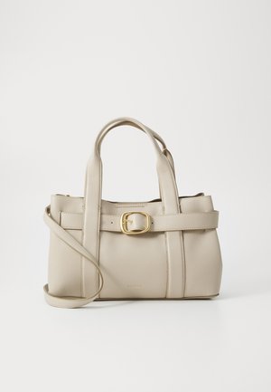 Beige handbag made of textured leather, featuring a structured design, top handles, a detachable shoulder strap, and a gold buckle accent.
