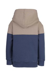 Huvtröja med en beige övre del och en marinblå nederdel. Tillverkad av mjuk tyg med en slät yta och ribbade mudd. 