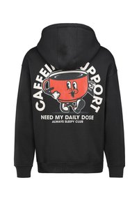 Schwarzer Hoodie mit einem großen Cartoon-Kaffeetassen-Graphic. Text lautet "KAFFEEUNTERSTÜTZUNG BRAUCHE MEINE TÄGLICHE DOSIS IMMER SCHLAFENDEN CLUB."