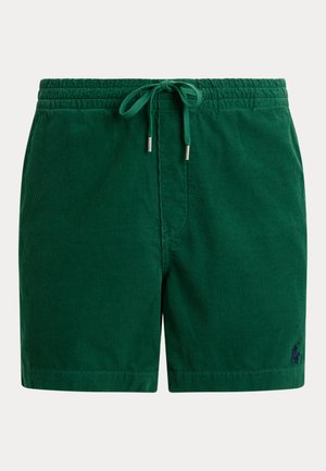 Short en velours côtelé vert avec ceinture élastique et cordon, avec un petit logo brodé sur la partie basse de la jambe gauche.