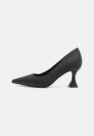Black satin high heel shoe with a pointed toe and a unique shaped heel. Smooth texture with a sleek design, suitable for formal occasions.