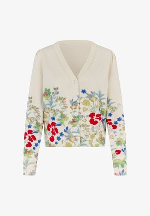 Kremna jopica z rožnim vezenjem v rdeči, modri in zeleni barvi. Ima v-izrez, zapenjanje na gumbe ter rebraste manšete in spodnji rob.