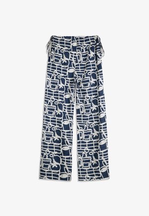 Pantalon large bleu marine avec des motifs abstraits en lignes blanches et des motifs de fruits, doté d'une taille élastique et de détails noués sur les côtés.