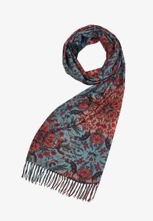 Rakstainais šalle ar tirkīza krāsu pamatu, kas rotāta ar ziedu un dzīvnieku motīviem sarkanās un brūnās krāsās, apmalē ir frēzētas malas.