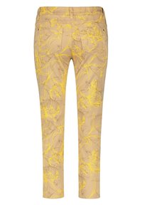 Beige byxor med blommönster i gult och brunt. Har två bakfickor och en slim fit-design. Midjehöjd med medelhög resår.