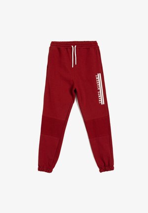 Rode sweatpants van zachte stof, met een elastische tailleband met trekkoorden, elastische boorden en een wit logo aan de zijkant.