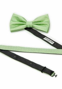 Grön fluga med prickar i tyg med struktur. Inkluderar ett svart justerbart band med spänne och etikett med varumärke.