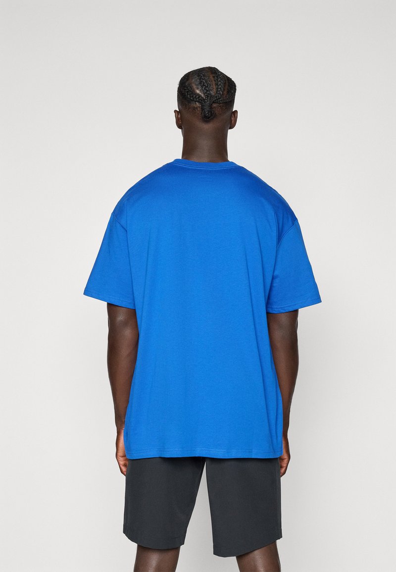 Nike Golf LOOSE FIT - Triko s potiskem - game royal