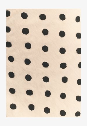 Cotton fabric with a beige background featuring a pattern of evenly spaced, textured black dots. Dots vary slightly in size and shape.