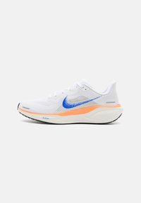 White athletic shoe with a mesh upper, blue logo, orange midsole accent, and black rubber sole, featuring a rounded toe and lace closure.