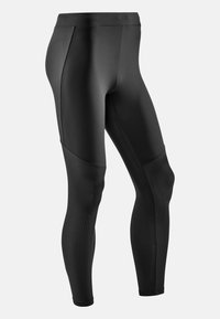 Leggings sportivi neri con finitura liscia, dotati di pannelli in rete testurizzati sulla parte bassa della gamba e una fascia alta in vita per un maggiore supporto.