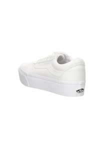 Sneaker bianco in tela con design low-top, lacci piatti, punta testurizzata e suola in gomma bianca; presenta un logo Vans sul tallone.