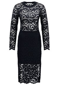 Robe midi noire en dentelle à manches longues avec motifs floraux et sections partiellement translucides aux manches, en haut de la poitrine et à l'ourlet.