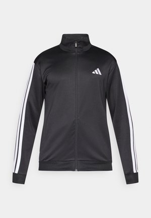 Giacca sportiva nera con collo alto, cerniera intera e dettagli a tre strisce bianche sulle maniche. Realizzata in tessuto liscio e leggero.