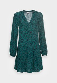 Teal klänning med långa ärmar, V-ringning och utsvängd nederdel. Har ett mörkt blommönster på lättviktsmaterial.