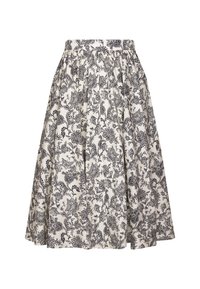 Jupe trapèze blanche avec motifs floraux et feuillages noirs complexes, taille froncée, longueur au genou, tissu fluide.