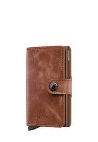 Brown leather wallet featuring a rounded shape, smooth texture, and a black button closure; includes a visible card holder on the side.