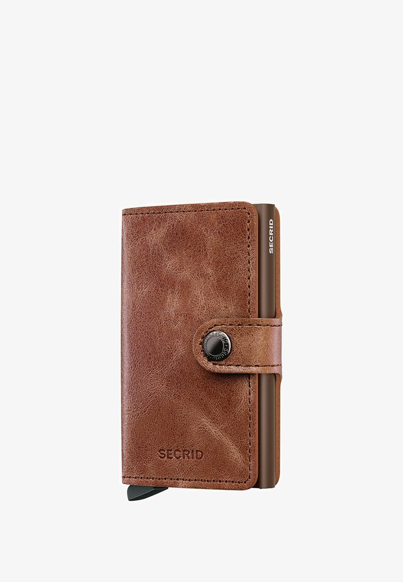 Brown leather wallet featuring a rounded shape, smooth texture, and a black button closure; includes a visible card holder on the side.