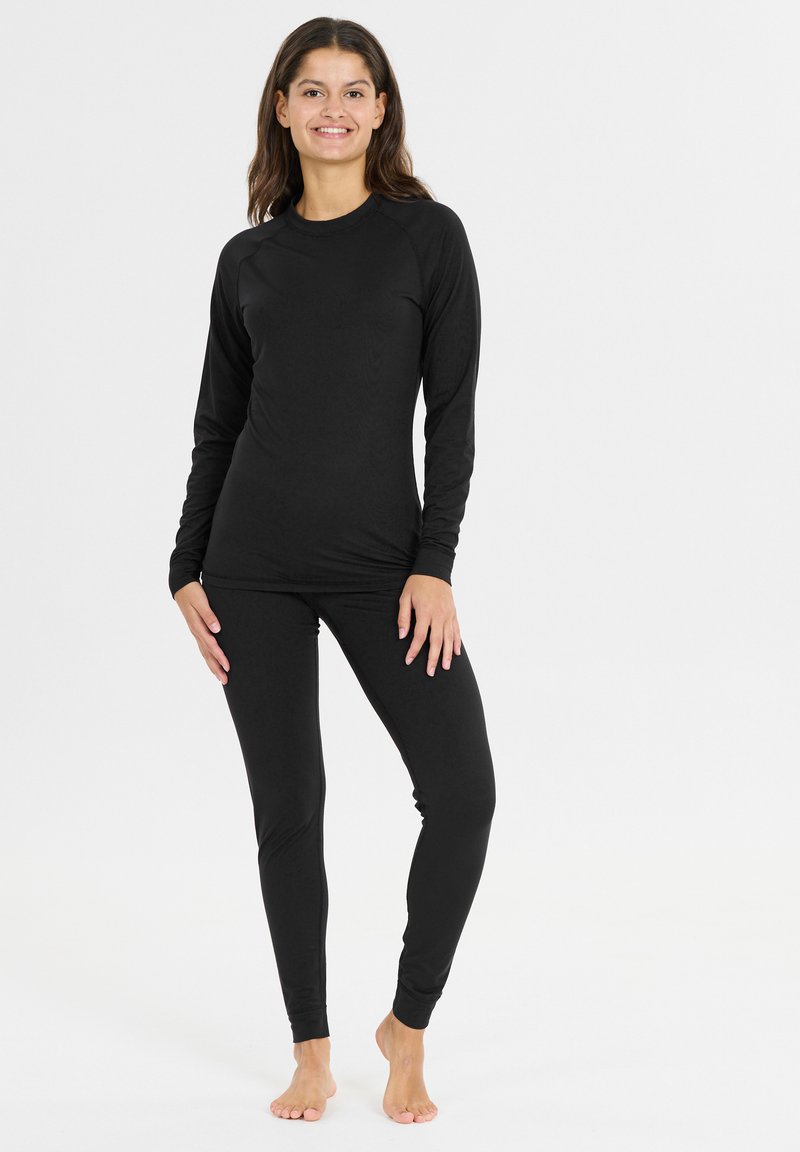 Sort langærmet top og leggings lavet af blød, strækbar stof. Simpelt design med rund halsudskæring og tætsiddende silhuet.