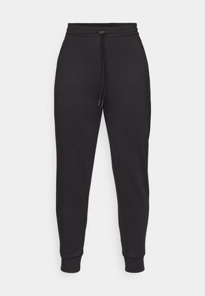 Schwarze Sweatpants aus weichem Stoff, mit einem elastischen Bund und Kordelzug, schmal zulaufenden Beinen und Seitentaschen.