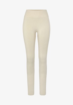 Beige Leggings mit hohem Bund, gerippter Textur, glatter Oberfläche und dezenten Musterdetails an den Beinen.