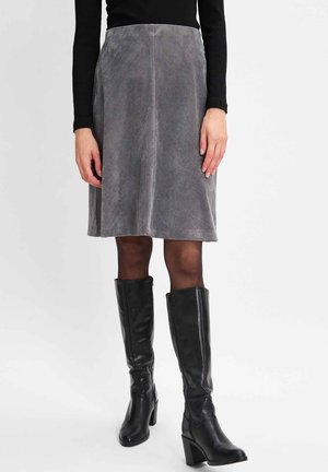 Gray corduroy skirt with a flared shape, featuring diagonal ribbed texture. Paired with knee-high black heeled boots.